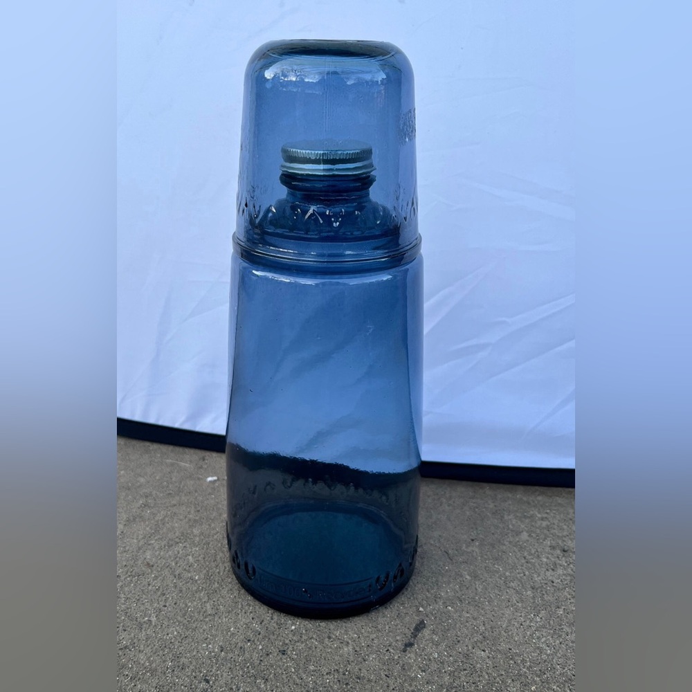 Vintage cobalt blue bottle with glass lid